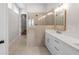 Bathroom featuring a large walk-in shower and double vanity sinks with modern hardware at 513 Godfrey Dr, Cumming, GA 30040