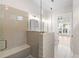 Bathroom showcasing a walk-in shower, bench seat, glass partition, and double vanity at 513 Godfrey Dr, Cumming, GA 30040