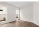 Cozy bedroom filled with natural light from two windows and neutral walls at 513 Godfrey Dr, Cumming, GA 30040