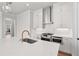 Modern kitchen with quartz countertops, stainless appliances, and stylish pendant lights at 513 Godfrey Dr, Cumming, GA 30040