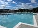 Large community pool with lounge chairs for residents to relax at 513 Godfrey Dr, Cumming, GA 30040