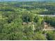 Aerial view of property showcasing its location in a wooded area with highway access nearby at 2806 Hedgewood Nw Dr, Atlanta, GA 30311