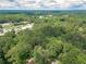 Expansive aerial view of a lush, green neighborhood featuring dense tree coverage and roads at 2806 Hedgewood Nw Dr, Atlanta, GA 30311