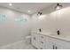 Modern bathroom featuring double sinks with black fixtures and recessed lighting at 2806 Hedgewood Nw Dr, Atlanta, GA 30311