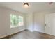 Bedroom features natural light, closet space and wood look flooring at 2806 Hedgewood Nw Dr, Atlanta, GA 30311