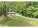 Charming ranch home with a freshly manicured lawn and driveway at 2806 Hedgewood Nw Dr, Atlanta, GA 30311