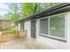 Exterior of home featuring painted brick, windows, and metal security door on the front porch at 2806 Hedgewood Nw Dr, Atlanta, GA 30311