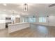 Beautiful kitchen with white cabinets, modern appliances, spacious island, and wood-look flooring at 2806 Hedgewood Nw Dr, Atlanta, GA 30311
