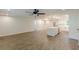 Open concept floorplan features spacious kitchen with island and seating, wood style laminate flooring at 2806 Hedgewood Nw Dr, Atlanta, GA 30311