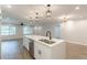 Kitchen with a center island featuring a stainless steel dishwasher and double sink with black hardware at 2806 Hedgewood Nw Dr, Atlanta, GA 30311