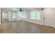 Bright living room featuring wood-look floors, neutral paint, a ceiling fan and several windows at 2806 Hedgewood Nw Dr, Atlanta, GA 30311