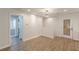 Living room with light gray walls, wood-look flooring, and access to the bath at 2806 Hedgewood Nw Dr, Atlanta, GA 30311