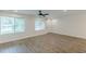 Bright, open living room with wood-look floors, white trim, neutral paint and many windows at 2806 Hedgewood Nw Dr, Atlanta, GA 30311