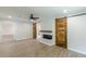 Living room features include barn doors, fireplace, ceiling fan, and light colored wood laminate flooring at 2806 Hedgewood Nw Dr, Atlanta, GA 30311