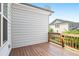 Exterior of a deck with wooden railing and wood flooring with a view of a neighboring building at 3657 Atherton Park Ct, Suwanee, GA 30024