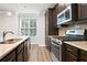 Well-equipped kitchen with granite countertops and stainless steel appliances at 3657 Atherton Park Ct, Suwanee, GA 30024