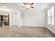 Bright living room features an open layout, hardwood floors, recessed lighting, and lots of natural light at 3657 Atherton Park Ct, Suwanee, GA 30024