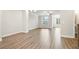 Spacious living room featuring wood-look floors and ample natural light at 3657 Atherton Park Ct, Suwanee, GA 30024