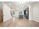 Open concept kitchen with dark cabinetry, large island, and wood-look floors at 3657 Atherton Park Ct, Suwanee, GA 30024