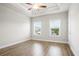 This spacious primary bedroom features hardwood floors, a tray ceiling, and natural light at 3657 Atherton Park Ct, Suwanee, GA 30024