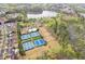 Community aerial featuring tennis courts and a lake at 610 Syemore Pass, Canton, GA 30115