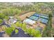 Aerial view of the community amenities, including pools, tennis courts, and clubhouse at 610 Syemore Pass, Canton, GA 30115