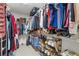 A spacious walk-in closet with shelving and hanging rods offers ample storage for clothes, shoes, and accessories at 610 Syemore Pass, Canton, GA 30115