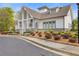 Beautiful clubhouse with stone accents, manicured landscaping, and ample parking at 610 Syemore Pass, Canton, GA 30115