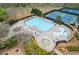 Aerial view of the large community pool with sun loungers, splash pad, and playground at 610 Syemore Pass, Canton, GA 30115