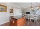 View of dining table and kitchen island, hardwood floors and neutral wall colors, creating an inviting atmosphere at 610 Syemore Pass, Canton, GA 30115