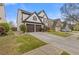 Suburban home showing the side and front featuring well manicured lawn and driveway at 610 Syemore Pass, Canton, GA 30115
