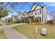 Suburban street featuring homes with manicured lawns and driveways on a sunny day at 610 Syemore Pass, Canton, GA 30115