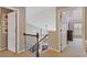 Upper hallway with wood railing and an open view of the floor below at 610 Syemore Pass, Canton, GA 30115