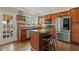 Modern kitchen featuring granite countertops, stainless steel appliances, and wood cabinets at 610 Syemore Pass, Canton, GA 30115
