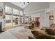 This living room with tall windows, plush sofas, and hardwood floors offers both comfort and style at 610 Syemore Pass, Canton, GA 30115
