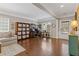 Spacious living room with hardwood floors, desk, and comfortable seating area at 610 Syemore Pass, Canton, GA 30115