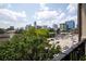 Enjoy spectacular city skyline views from this home's balcony overlooking lush greenery at 625 Piedmont Ne Ave # 3029, Atlanta, GA 30308