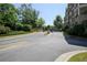 Entrance to condominium complex with meticulous landscaping and paved entry way at 625 Piedmont Ne Ave # 3029, Atlanta, GA 30308
