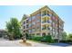Upscale brick condominium building featuring multiple balconies and well-manicured landscaping at 625 Piedmont Ne Ave # 3029, Atlanta, GA 30308