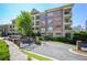 Well-maintained brick condominium complex with a gated entrance and mature landscaping at 625 Piedmont Ne Ave # 3029, Atlanta, GA 30308