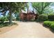 Grand estate with a circular driveway surrounded by lush landscaping offers a luxurious and private setting at 625 Piedmont Ne Ave # 3029, Atlanta, GA 30308