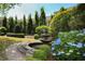 A serene courtyard fountain surrounded by lush greenery and manicured landscaping offers a tranquil escape at 625 Piedmont Ne Ave # 3029, Atlanta, GA 30308