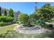 A serene courtyard fountain surrounded by lush greenery and manicured landscaping offers a tranquil escape at 625 Piedmont Ne Ave # 3029, Atlanta, GA 30308
