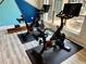 Modern gym featuring two Peloton bikes and a rowing machine at 625 Piedmont Ne Ave # 3029, Atlanta, GA 30308
