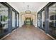 Elegant condominium lobby with brick flooring, stone archways, and stylish lighting at 625 Piedmont Ne Ave # 3029, Atlanta, GA 30308