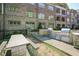 Outdoor kitchen with stone counters and stainless steel gas grills offer a culinary experience at 625 Piedmont Ne Ave # 3029, Atlanta, GA 30308