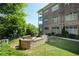 Outdoor kitchen with stone counters and stainless steel gas grills offer a culinary experience at 625 Piedmont Ne Ave # 3029, Atlanta, GA 30308