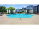 Beautiful pool area with lounge seating, a waterfall feature, and decorative planters at 625 Piedmont Ne Ave # 3029, Atlanta, GA 30308