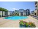 Inviting community pool with comfortable seating, lush landscaping, and scenic city views at 625 Piedmont Ne Ave # 3029, Atlanta, GA 30308