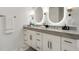 Modern bathroom with dual sinks, marble countertops, and white cabinets at 2795 Peachtree Rd # 1305, Atlanta, GA 30305
